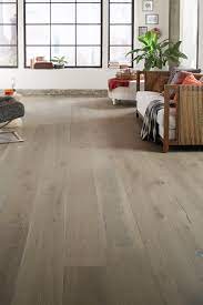 This reclaimed white oak floor has been sanded smooth and given a clear finish to let its age, patina, and wear marks show. Perlino White Oak Distressed Engineered Hardwood Xl Plank In 2021 Light Hardwood Floors Engineered Hardwood Flooring
