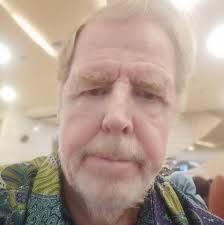 Which island in Thailand is ideal to visit in August for a budget beach  trip?