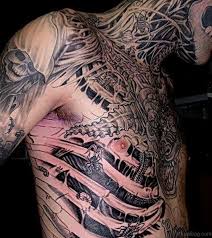 Rib cage name tattoo idea. 50 Rare Biomechanical Tattoos For Rib