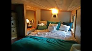 Naturally distressed wood floors in the main living area, and ceramic tile floors in the bathroom. 3 Bedroom Tiny House Built For Family Tiny Living Youtube