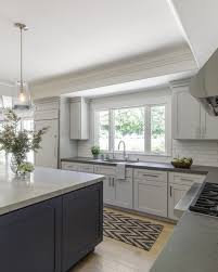 The Custom Navy Blue Island Is A Perfect Contrast To The Soothing Grey Cabinetry Kitchen Transiti Grey Kitchen Designs Light Gray Cabinets New Kitchen Cabinets