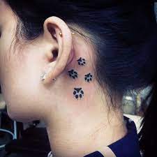 Pin For Later 30 Brilliantly Simple Behind The Ear Tattoo Ideas Paw Prints Ear Tattoo Ideas Tattoos Dog Print Tattoo