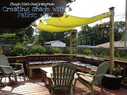 Create A Simple Fabric Sail To Add Shade To Your Outdoor Space In No Time Diy 2 Boys 1 Girl One Crazy Mom Shade Sails Patio Patio Shade Backyard Shade