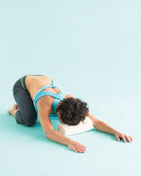 Releases The Muscles In The Back Gently Opens The Hips Boosts Your Energy Sit Back On Your Heels With Your Legs Folded Under You And Yoga Poses Yoga Poses