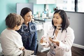Female Doctor Explaining Medical Equipment To Family In Clinic Stock Photos Ad Explaining Medical Female Doctor Female Doctor Medical Medical Equipment