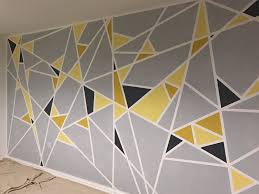 Juegoal 2 pack 16 large metal flowers wall art inspirational daisy wall decor sunflower hanging for indoor outdoor home bedroom living room office garden, white & yellow 4.7 out of 5 stars 152 $29.99 $ 29. Geometric Painted Wall Shades Of Yellow And Grey With Masking Tape Tape Wall Art Geometric Wall Paint Diy Wall Painting
