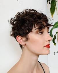 Soft and with a hint of nostalgia. 21 Best Short Curly Hair With Bangs To Try This Year