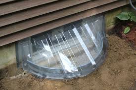 If a window well is not properly installed or if the drain becomes clogged, the window well can fill with water. Ideas For Basement Window Covers Basement Window Well Window Well Cover Basement Window Coverings