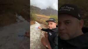 Favian Lameda walking through the rainy streets of San Pedro de la Cueva  (January 22, 2024)