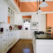 An All White Kitchen Is Warmed Up By A Summery Peach Hue On The Walls Slightly Bitters Tiny Kitchen Design Kitchen Remodel Interior Design Kitchen