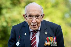 War hero captain tom moore, 99, raises £13 million* for the nhs by doing one hundred laps of his garden on a wheeled zimmer frame. D4wahdigtw8zcm