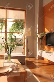 Courtesy of photographer patrick perkins, this living the lighting fixtures are the focal point of this room located in copenhagen, denmark. Modern Living Room Design With Wooden Floor With Big Window Stock Photo Picture And Royalty Free Image Image 93313220