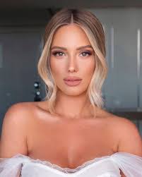 Who can provide hair and makeup services in Grand Rapids for a wedding?