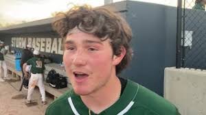 Millard West's Korey Cozad talks with Mike Patterson after winning Metro  title