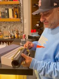 Our good friend and favorite comedian @russellpeters showing off our  Corkscrew #comedy #russelpeters #gift #love #barcart #blackandgold