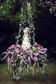 A Masterpiece Of Pure Prettiness And A Glimpse Into A Garden Of Eden Inspired Enchanted Garden Wedding Wedding Cake Table Fairy Wedding
