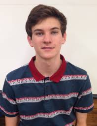 Students pray for Drew Williams near flagpole