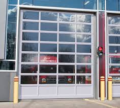 The cost of capital in idle above the loading dock side of the building, a cantilevered metal insulated panel overhang. Commercial Industrial Agricultural Garage Doors Garaga