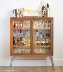 This display case features adjustable shelves and an inset french. How To Diy A Retro Mid Century Cocktail Cabinet For Your Festive Parties