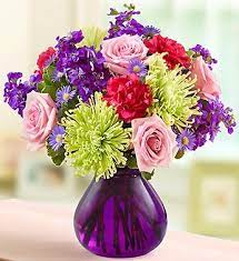 This Majestic Purple Vase Is Filled With Purple Stock Pink Roses Carnations And Mums A Combination Mothers Day Flowers Flower Delivery Fresh Flowers Online