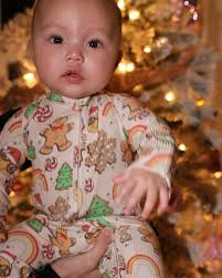 Saylor is just chillin' in her new Xmas Jammies from @millieandroo in front  of the tree looking as cute (but serious!) as ever!! 🎄🎁 #xmasjammies  #baby #cutebaby #holidaybaby