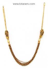 Black And Gold Jewelry Stand 22k Gold Lion Mangalsutra Black Beads Chain With Pearls 235 Bbc1233 Buy This Latest India Jewelry Bracelets Gold Gold Jewelry Fashion Gold Jewelry Stores