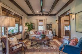 The Wood Beams Are Left Intact But The Textured Ceiling Has Been Removed To Reveal The Original Tongue And Home Town Hgtv Hgtv Living Room Living Room Makeover