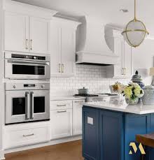 Love The Striking Nautical Blue Crystal Cabinets Island In This White Kitchen With Monogram In 2020 Professional Kitchen Appliances Monogram Appliances Cabinet Island