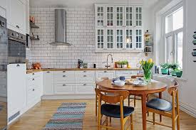 This kitchen/dining area has a spare scandinavian sensibility. Scandinavian Style For Small Kitchen Ideas Roohome