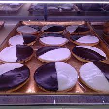 Come Enjoy Our Delicious Black White Cookies Dortonibakery Blackandwhitecookies Yummy Delicious Specialty Cakes Bakery American Desserts