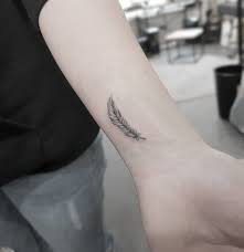 50 Beautiful Feather Tattoo Designs Tattooadore Feather Tattoo Design Feather Tattoo Tattoos