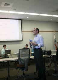 Dean Karp gives presentation to board