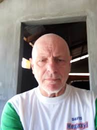 What car was he racing against in 1965 song?