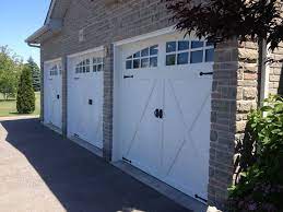 9x8 Clopay Coachman Series Doors With Decorative Hardware And Aluminum Capping Garage Door Installation Garage Door Styles Garage Door Types