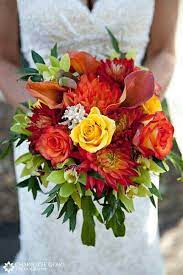 Maybe you would like to learn more about one of these? Beautiful Bridal Bouquet Showcasing Yellow Roses Orange Red Orange Roses Flame Orange Calla Li Bridal Bouquet Fall Red Bouquet Wedding Fall Wedding Bouquets