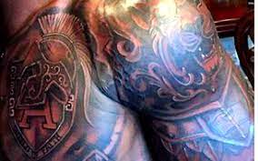 Adrian peterson received a warm welcome from vikings fans as he arrived at training camp in mankato, minnesota, saturday, and the 2012 nfl mvp will be sporting a new look underneath his. Look Adrian Peterson Shows Off New Armor Of God Tattoo Cbssports Com
