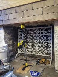 Go over the entire area with a wire brush to dislodge any loose mortar, then scrub off the soot with a rag soaked in white vinegar. Renovating With A Tile Over Brick Fireplace Design