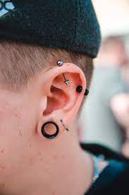 Piercing Apparel Clothing And Hat Hd Photo By K I L I A N Kilianfoto On Unsplash Idees De Piercing Piercing Visage Piercings Oreille