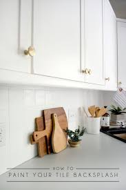 One tip to removing backsplash tile is to go in on an angle so that you do not go directly into the drywall. How To Paint Your Tile Backsplash Brepurposed
