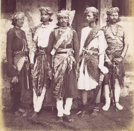 Circa early 1860's. India, Delhi. 'Rajpoots.' 'The group photograph shows a party of Chohan soldiers armed in the native manner. The figure on the right has a broad shield at his back,