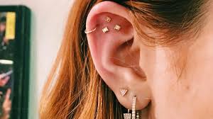 Cancer zodiac tattoo with roman numerals. Ear Piercing Ideas Constellation Piercings Are A Thing Now And They Re Crazy Pretty Glamour