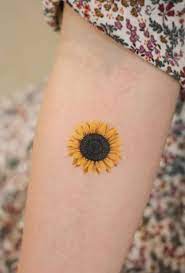 Big flowers, for example, show the dedication one has in life while small tattoos symbolize worship and the fact that one believes in a supreme being. Little Sunflower Tattoo Get An Inkget An Ink
