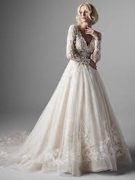 The cascades along the skirt add flirty volume and the sparkly lace detailing makes this a favorite for brides who love whimsical wedding dresses. Long Sleeve Lace Ball Gown Wedding Dress Kleinfeld Bridal