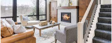 In the foreground is a vintage, bamboo chair. Fireplace Tile Ideas For 2021 The Tile Shop