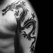 101 Best Dragon Tattoos For Men Cool Design Ideas 2021 Guide Tribal Dragon Tattoo Dragon Tattoos For Men Tattoos For Guys