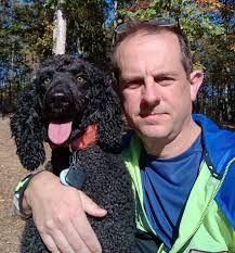 new owners of a black poodle