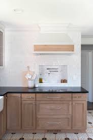 It's always fun when something added for utility — in this case, to protect kitchen walls from water and worse — is used as an excuse to add beauty. Our Kitchen Renovation Reveal Room For Tuesday