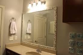 The top part was actually a trim with swarovski crystals that went all the way around the room, but the rest of the sides were just polished 10mm box trim. How To Frame A Mirror With Tile