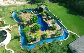 Attract butterflies to your backyard (allentucklandscaping.com). Extreme Residential Lazy River Pools Lonestar Fiberglass Pools Lonestar Fiberglass Pools Backyard Pool Designs Backyard Pool Pool Houses