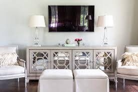 Chic Living Room Features A Pair Of Gray French Chairs And Oatmeal Linen Skirted Ottomans Placed In Front Of Chic Living Room Living Room Tv Living Room Decor